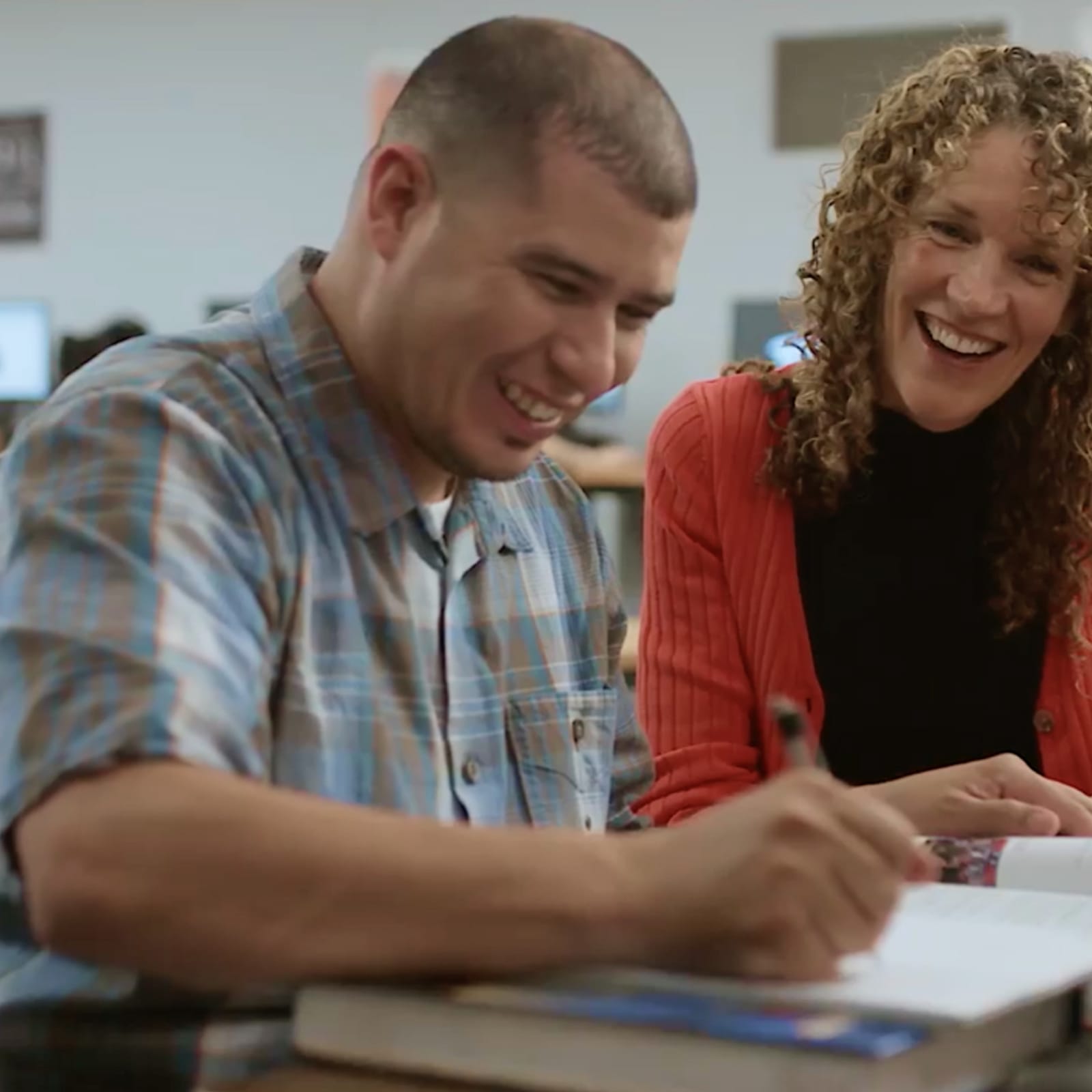 Teacher helping an adult student